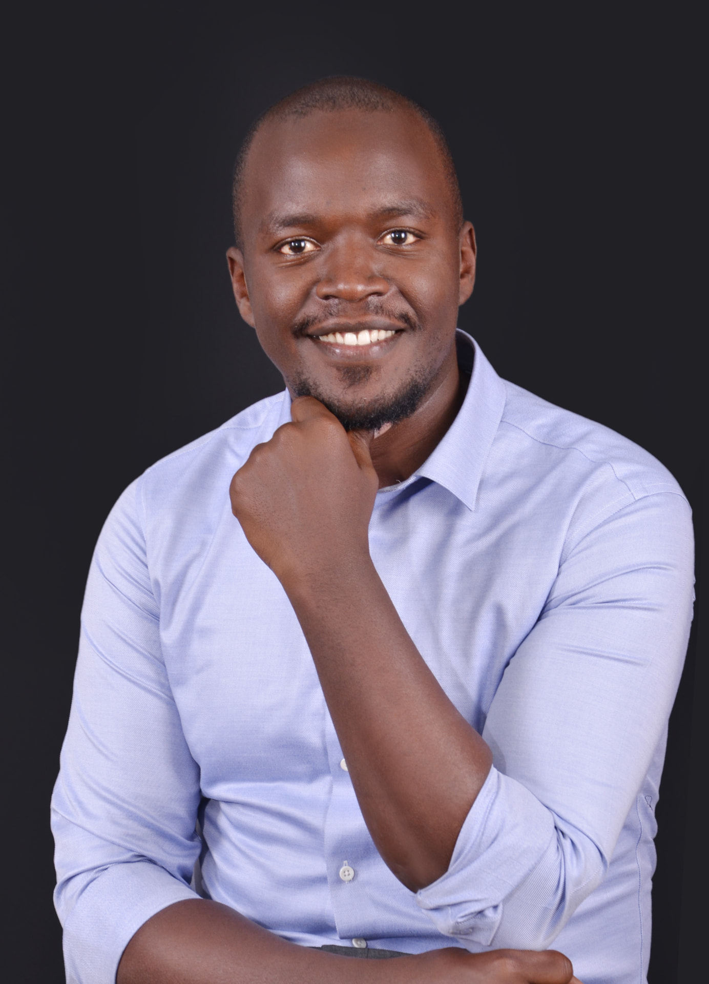Brian Karoney seated for a professional studio portrait